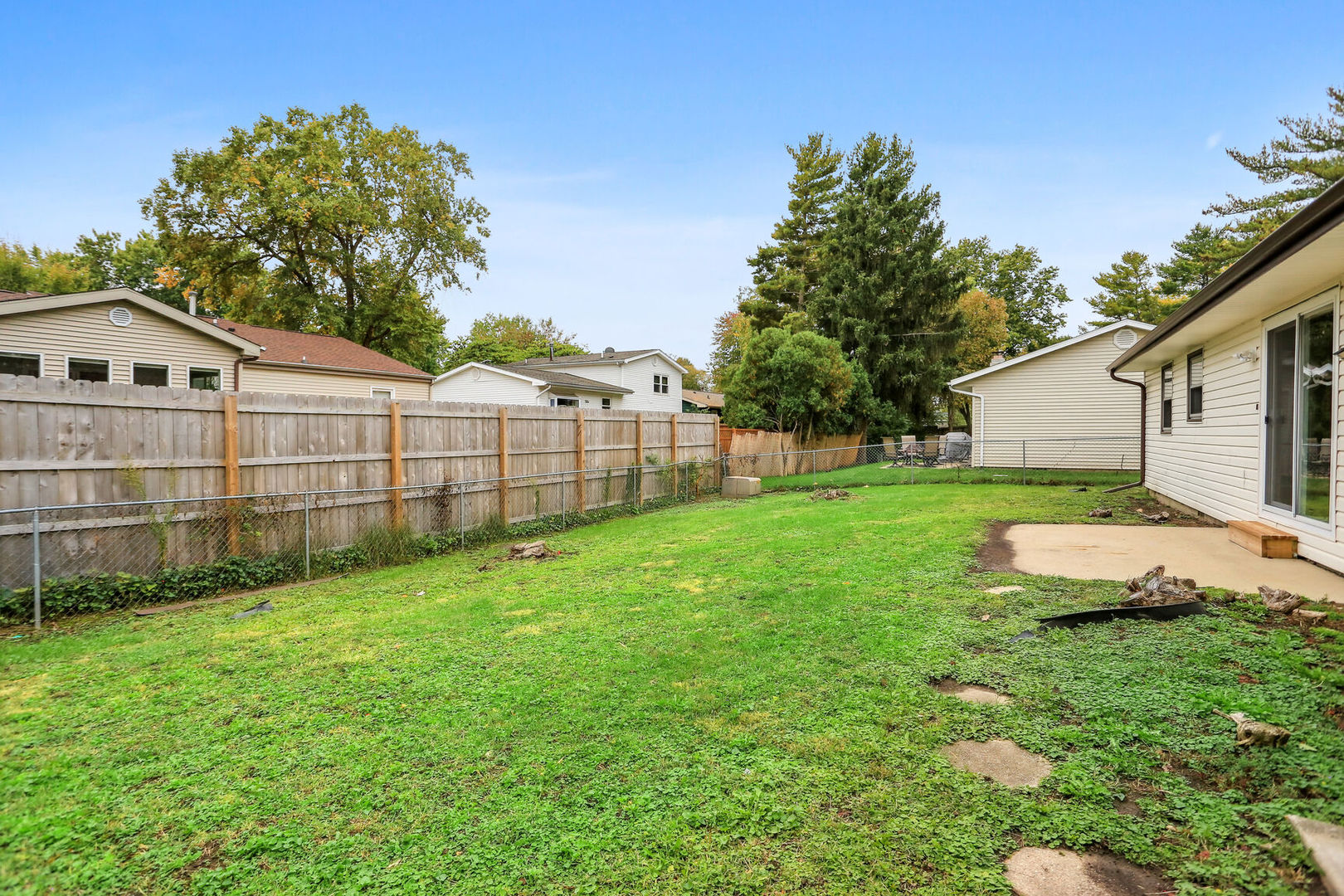 2307 Aspen Drive Champaign, IL 61821 - Photo 8 of 26 a view of a backyard with a garden