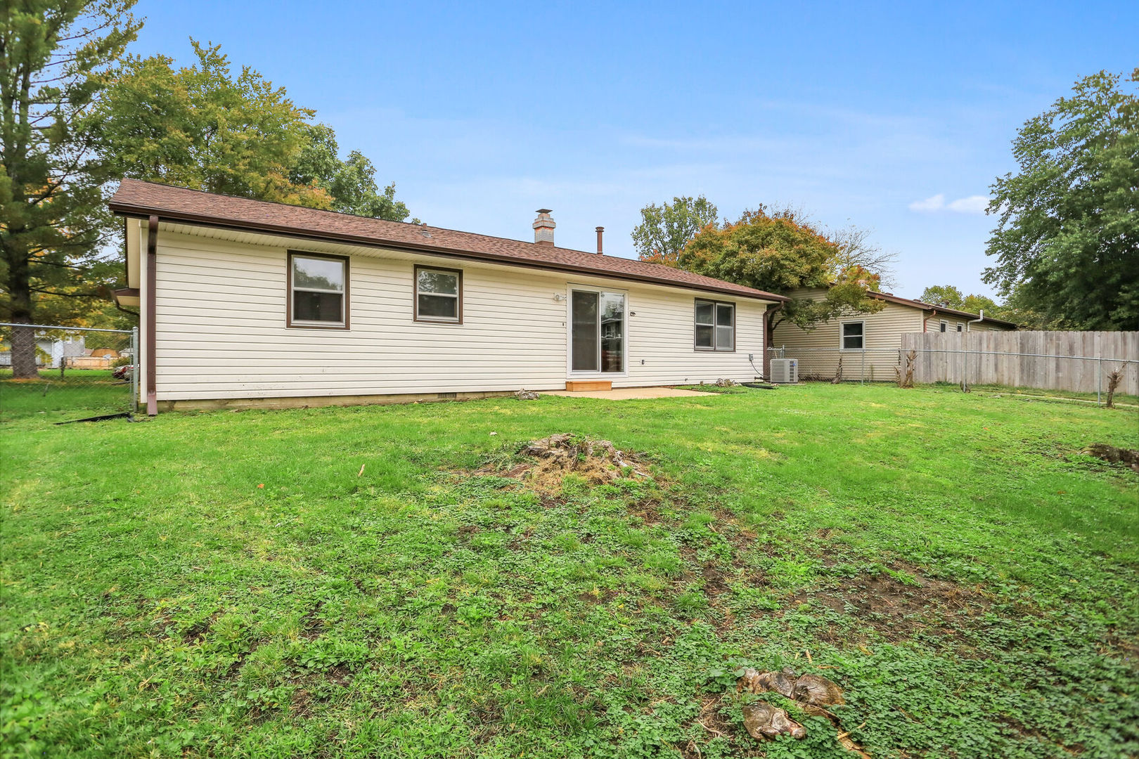 2307 Aspen Drive Champaign, IL 61821 - Photo 9 of 26 a view of a house with a yard and potted plants