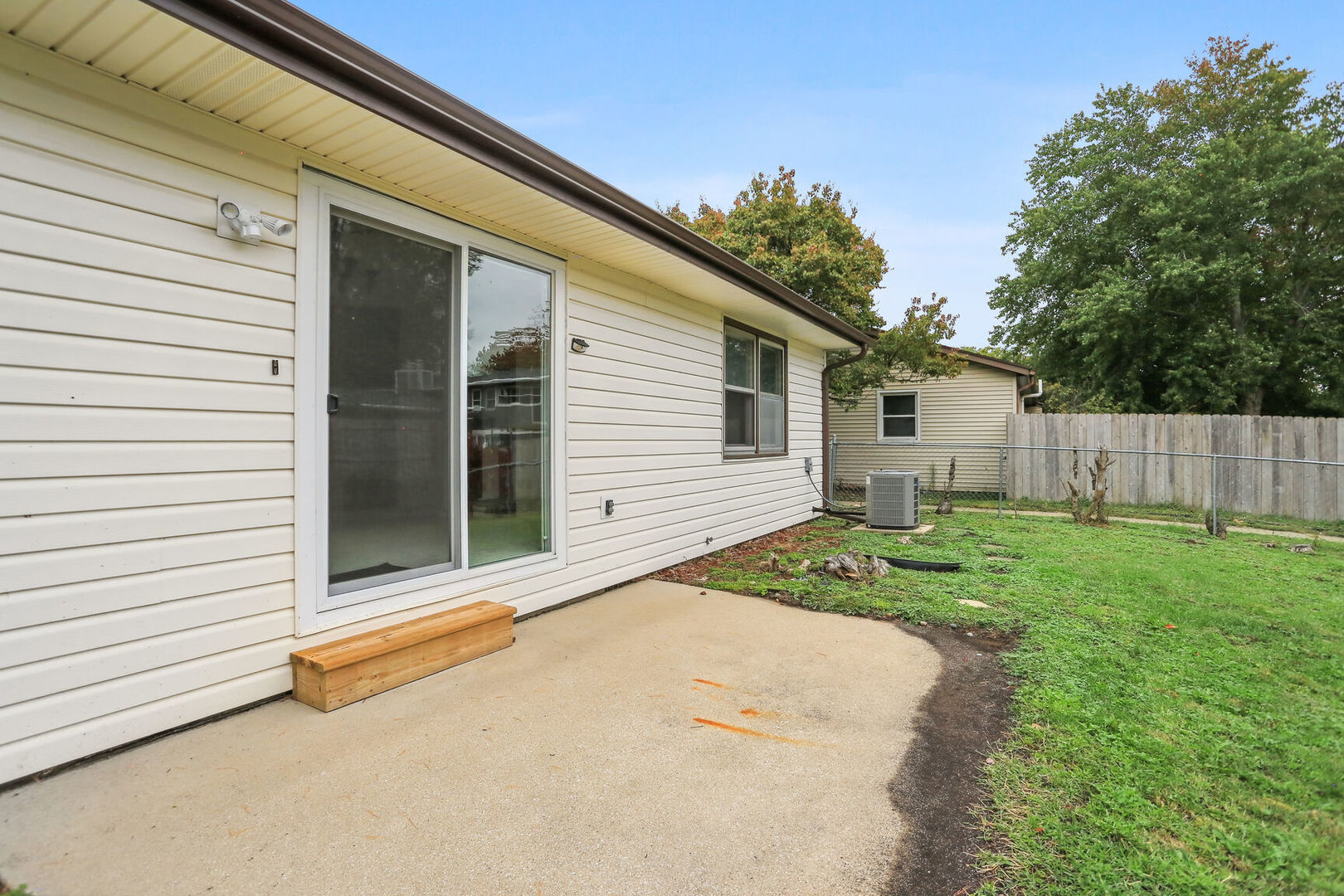 2307 Aspen Drive Champaign, IL 61821 - Photo 10 of 26 a view of a backyard with a garden
