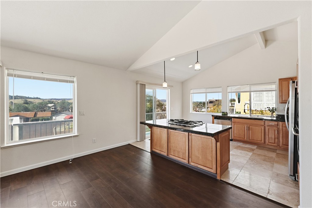 629 Poker Flat Road Copperopolis, CA 95228 - Photo 14 of 71 a kitchen with stainless steel appliances granite countertop a stove and a view of living room