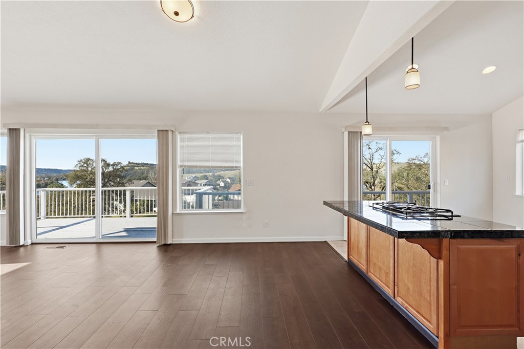 629 Poker Flat Road Copperopolis, CA 95228 - Photo 15 of 71 an empty room with wooden floor and windows