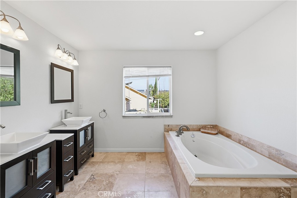 629 Poker Flat Road Copperopolis, CA 95228 - Photo 30 of 71 a spacious bathroom with a bathtub and a sink