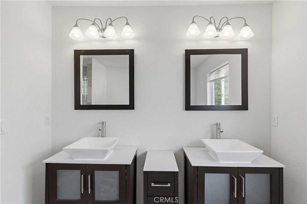 629 Poker Flat Road Copperopolis, CA 95228 - Photo 31 of 71 a bathroom with a sink and a mirror