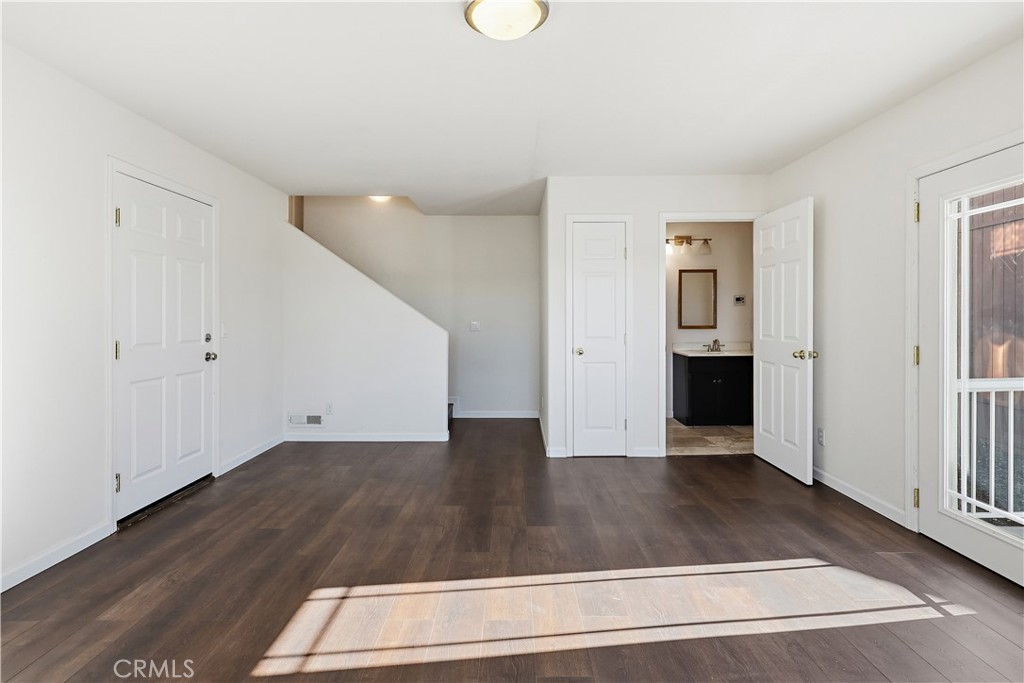 629 Poker Flat Road Copperopolis, CA 95228 - Photo 50 of 71 a view of an empty room with wooden floor and a window