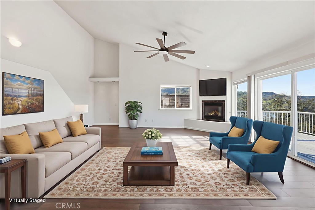 629 Poker Flat Road Copperopolis, CA 95228 - Photo 7 of 71 a living room with furniture and a fireplace