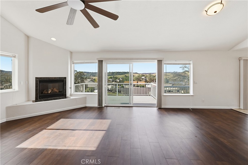 629 Poker Flat Road Copperopolis, CA 95228 - Photo 8 of 71 a view of an empty room with wooden floor and a fireplace