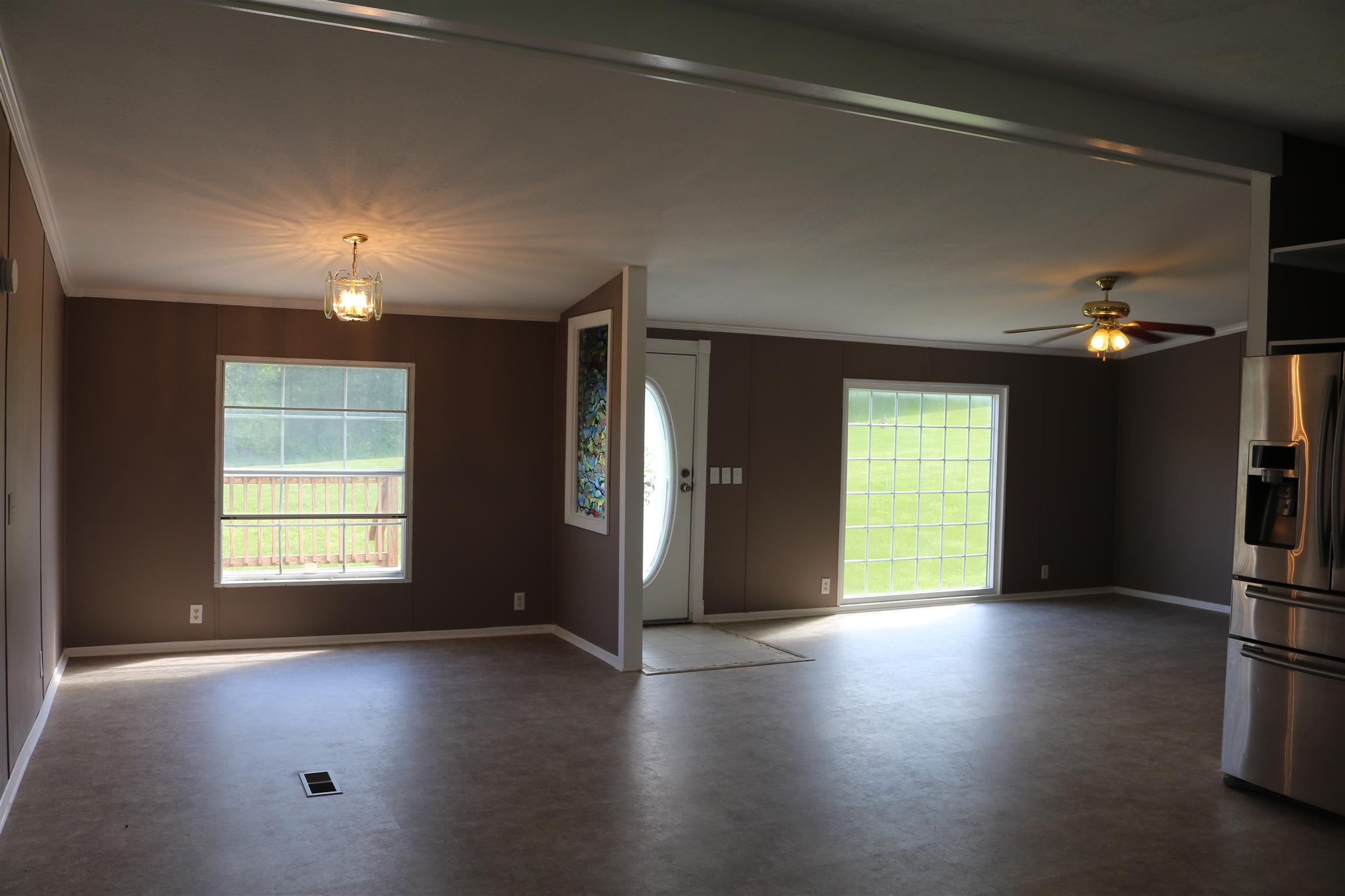 3630 Beasleys Bend Road Lebanon, TN 37087 - Photo 3 of 12 a view of an empty room with a window and wooden floor