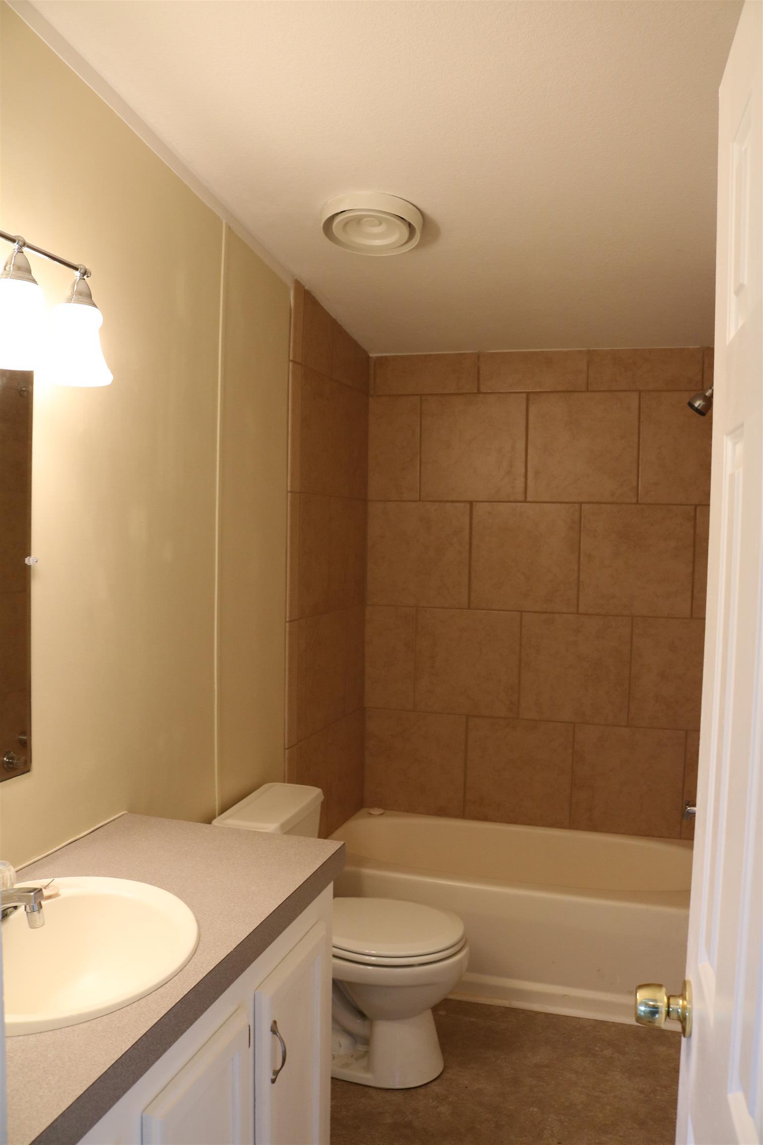 3630 Beasleys Bend Road Lebanon, TN 37087 - Photo 8 of 12 a bathroom with a sink a toilet and shower