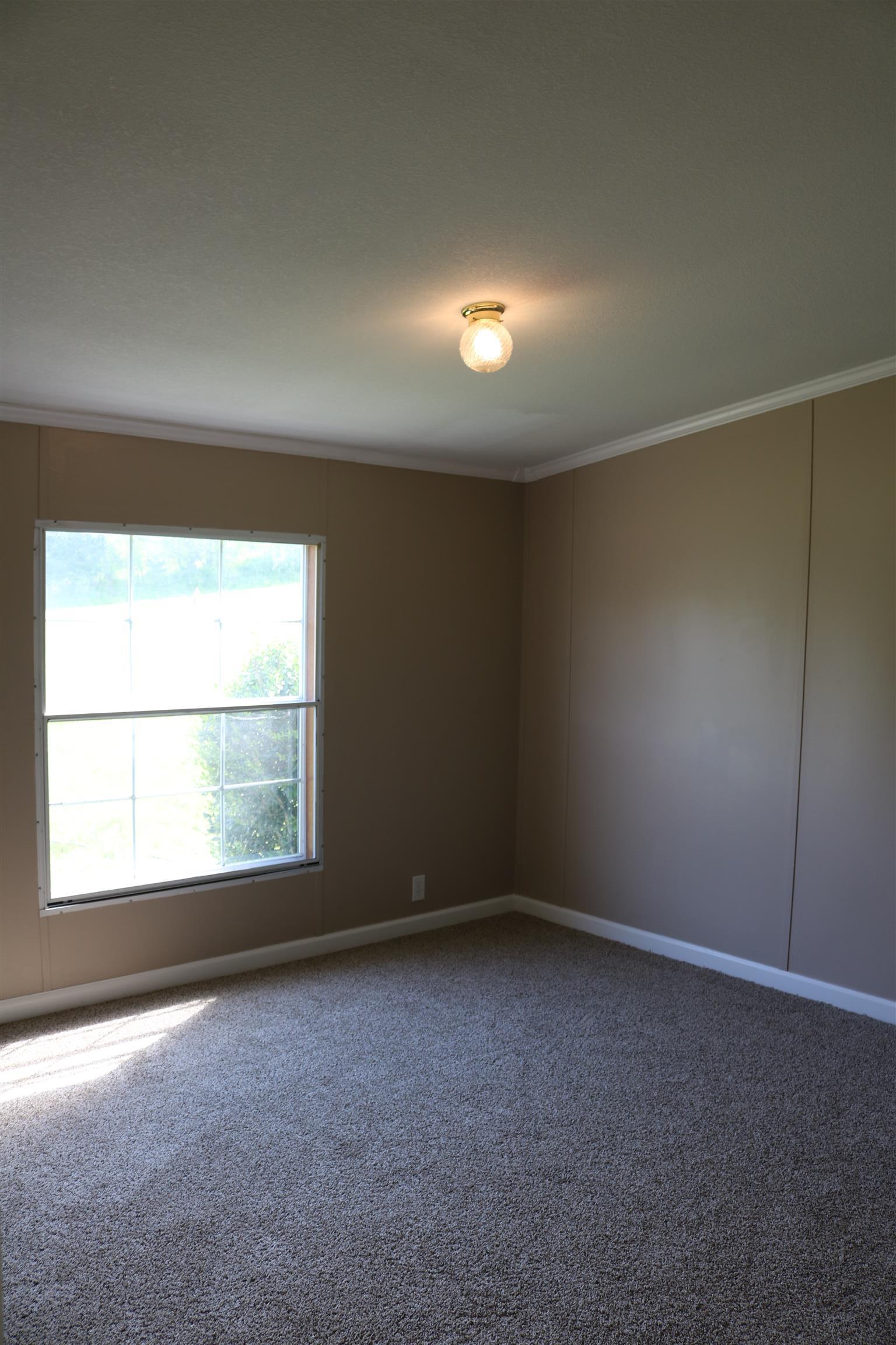 3630 Beasleys Bend Road Lebanon, TN 37087 - Photo 9 of 12 an empty room with a empty space and windows