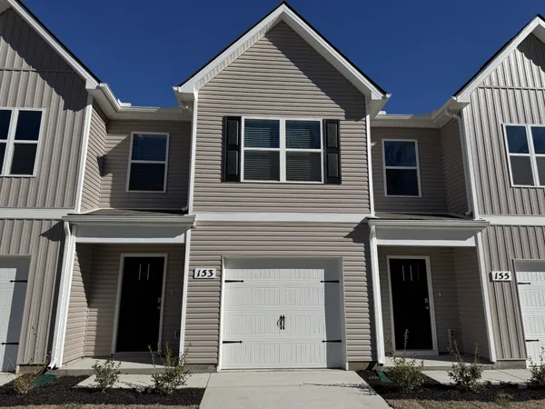 a front view of a house with stairs