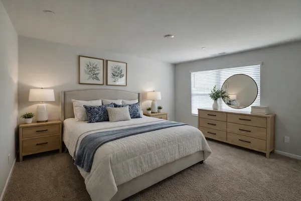 a bed room with a bed and a dresser