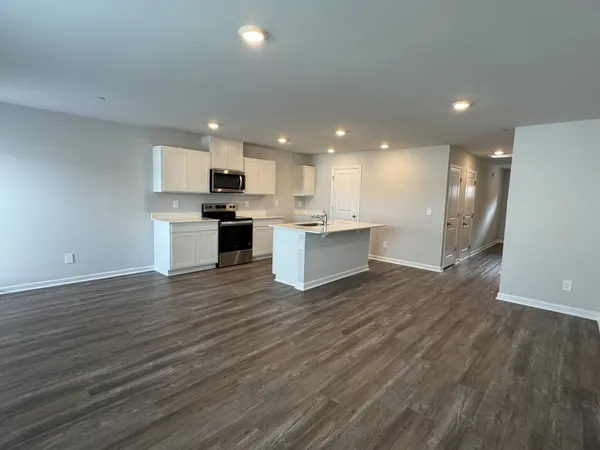 a open kitchen with kitchen island a sink dishwasher a stove and a refrigerator