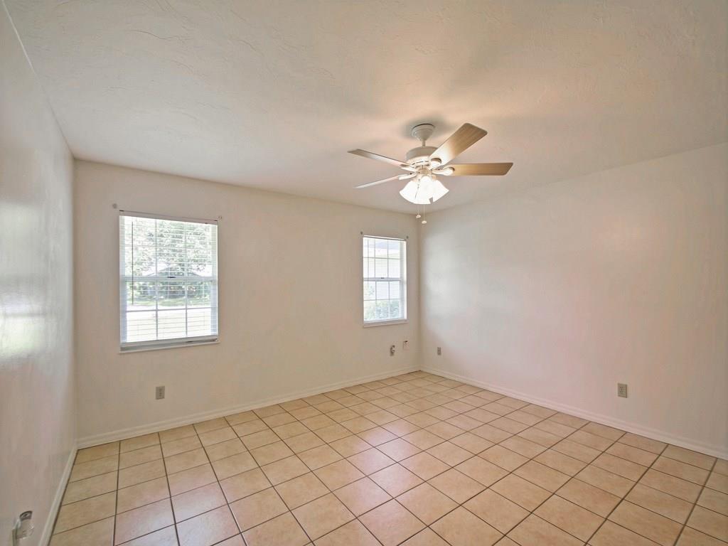 774 24th Square Vero Beach, FL 32962 - Photo 13 of 33 an empty room with chandelier fan