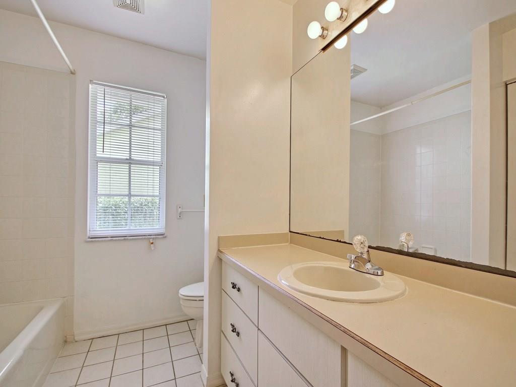 774 24th Square Vero Beach, FL 32962 - Photo 21 of 33 a bathroom with a sink toilet and vanity