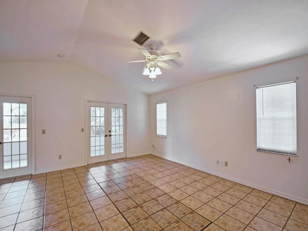 774 24th Square Vero Beach, FL 32962 - Photo 6 of 33 an empty room with windows and fan