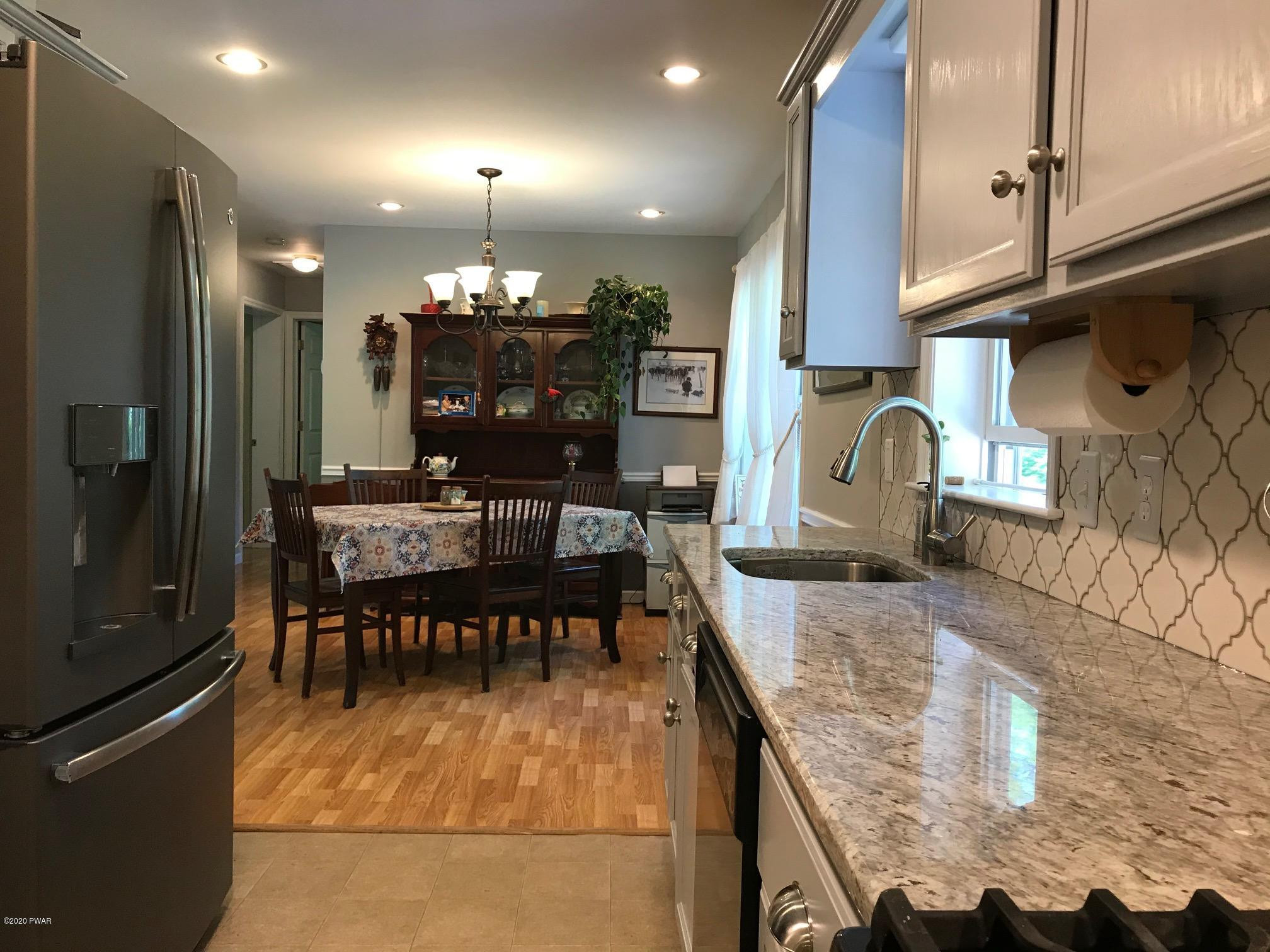 39 Grell Road Hawley, PA 18428 - Photo 15 of 44 KITCHEN INTO DINING