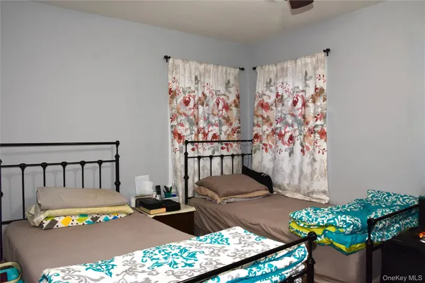 a bedroom with a bed and a table