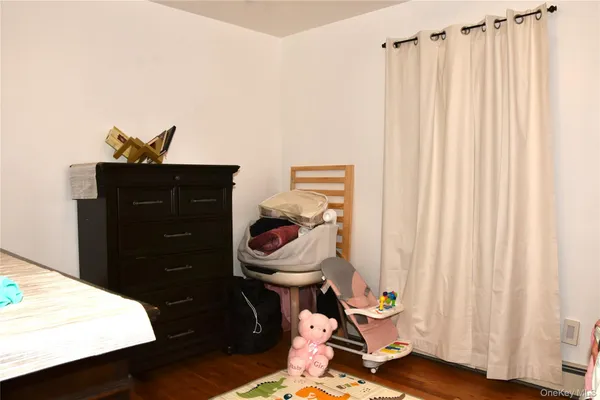 a living room with a black white checkered floor and a chair