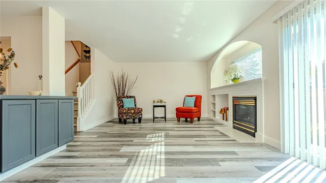 a view of lobby with wooden floor and windows