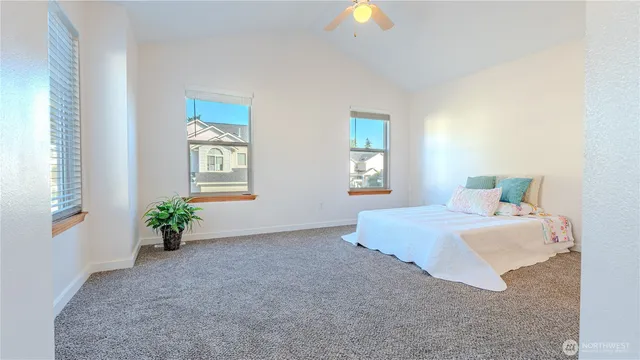 a room with a bed and a window