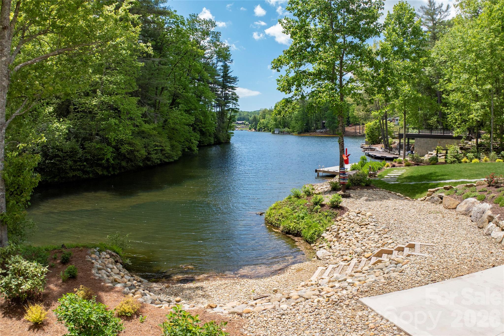 2235 Cold Mountain Road Lake Toxaway, NC 28747 - Photo 41 of 47 a view of a lake with a yard