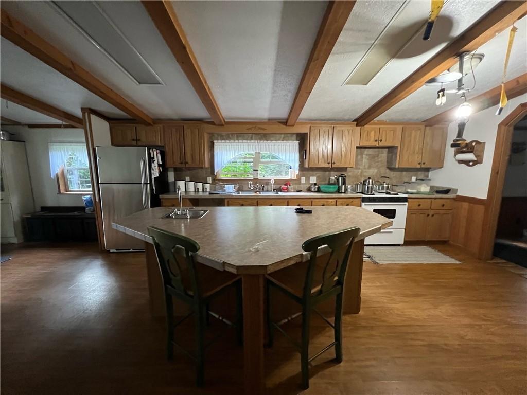 1197 Bonner Road Rossiter, PA 15772 - Photo 10 of 25 a kitchen with stainless steel appliances granite countertop table chairs sink and cabinets
