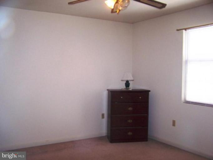 85 Walnut Creek Road Huntingtown, MD 20639 - Photo 12 of 19 a room with a dresser