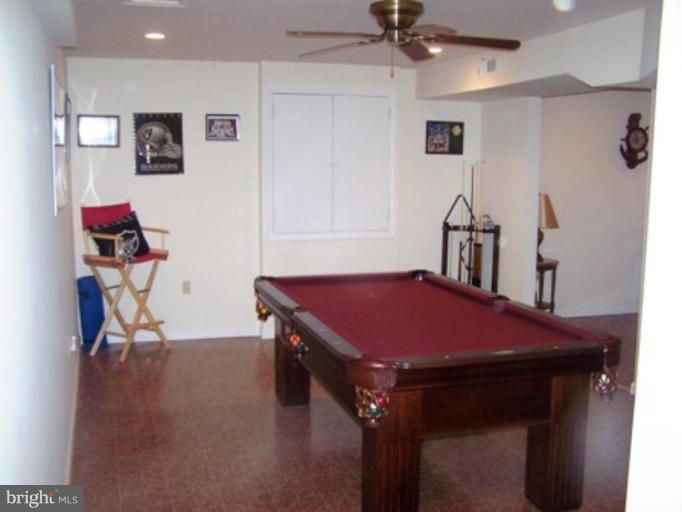 85 Walnut Creek Road Huntingtown, MD 20639 - Photo 14 of 19 a view of a room with gym equipment
