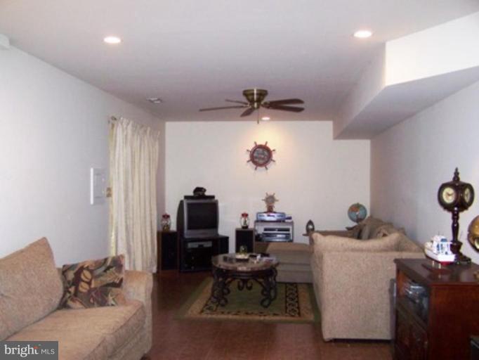 85 Walnut Creek Road Huntingtown, MD 20639 - Photo 16 of 19 a living room with furniture and a window