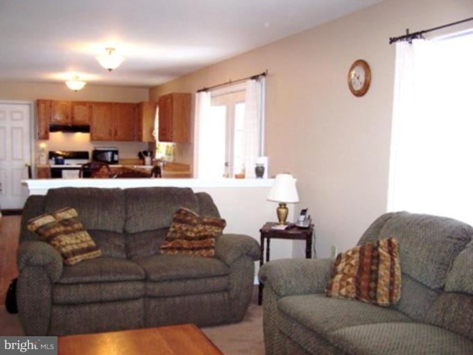 85 Walnut Creek Road Huntingtown, MD 20639 - Photo 6 of 19 a living room with furniture