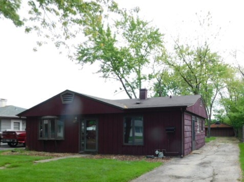 a view of house with yard and entertaining space