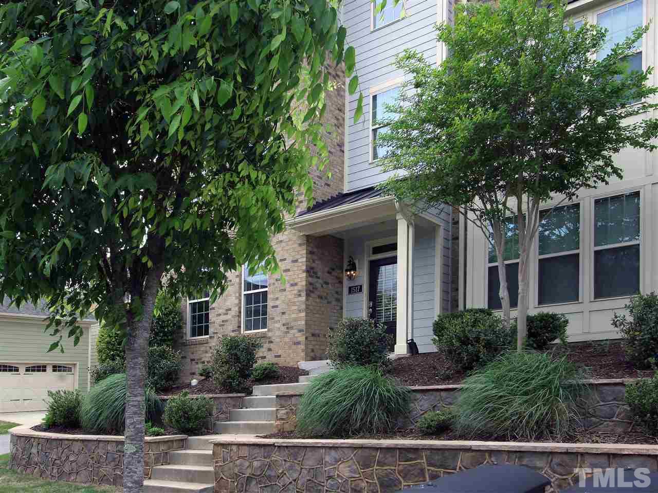 1517 Rodessa Run Raleigh, NC 27607 - Photo 3 of 25 a front view of a house with plants and trees