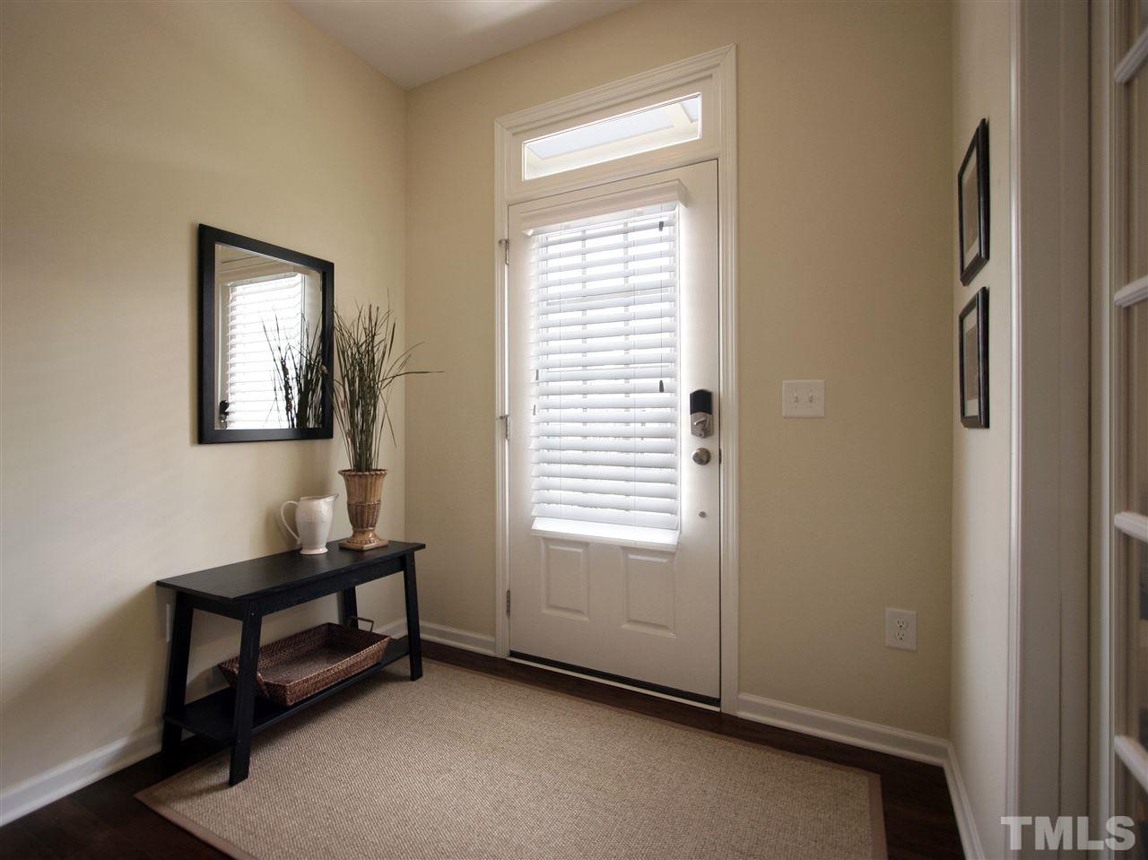 1517 Rodessa Run Raleigh, NC 27607 - Photo 4 of 25 a room that has a window and a dresser