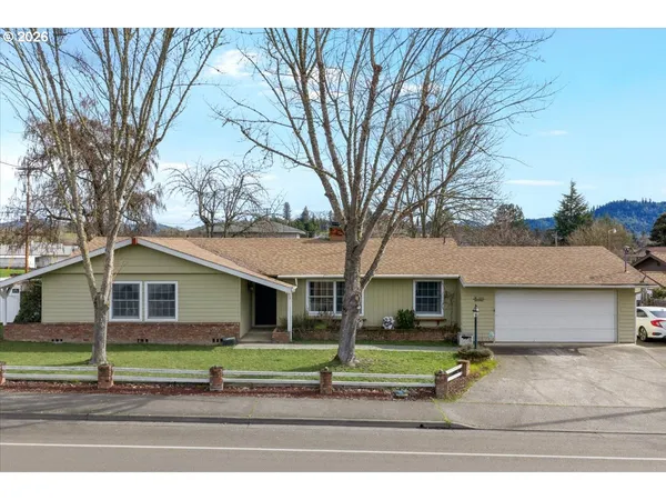 a house with trees in the background