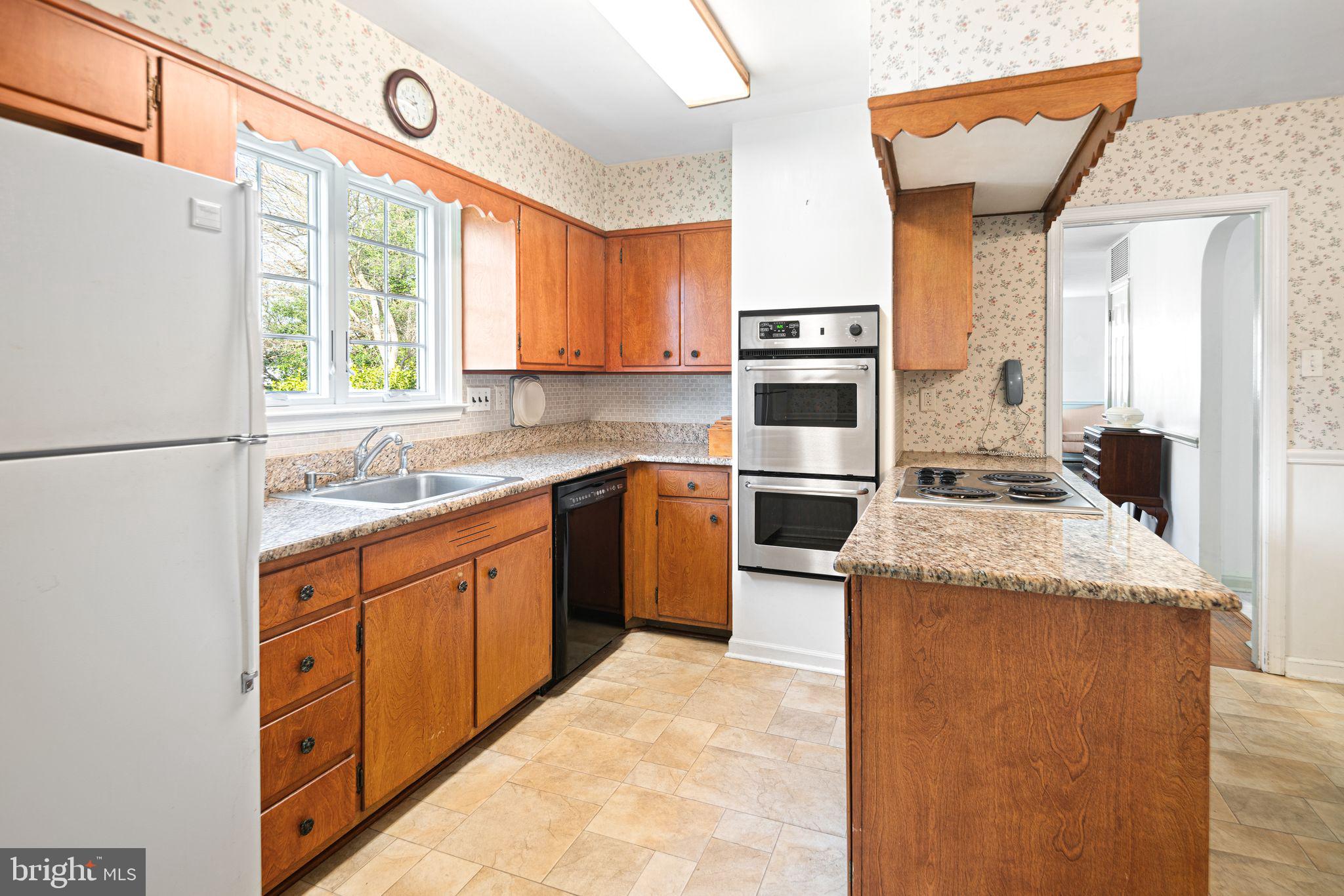 2809 Hunterdon Drive Cinnaminson, NJ 08077 - Photo 12 of 31 a kitchen with stainless steel appliances granite countertop a stove a sink and a refrigerator
