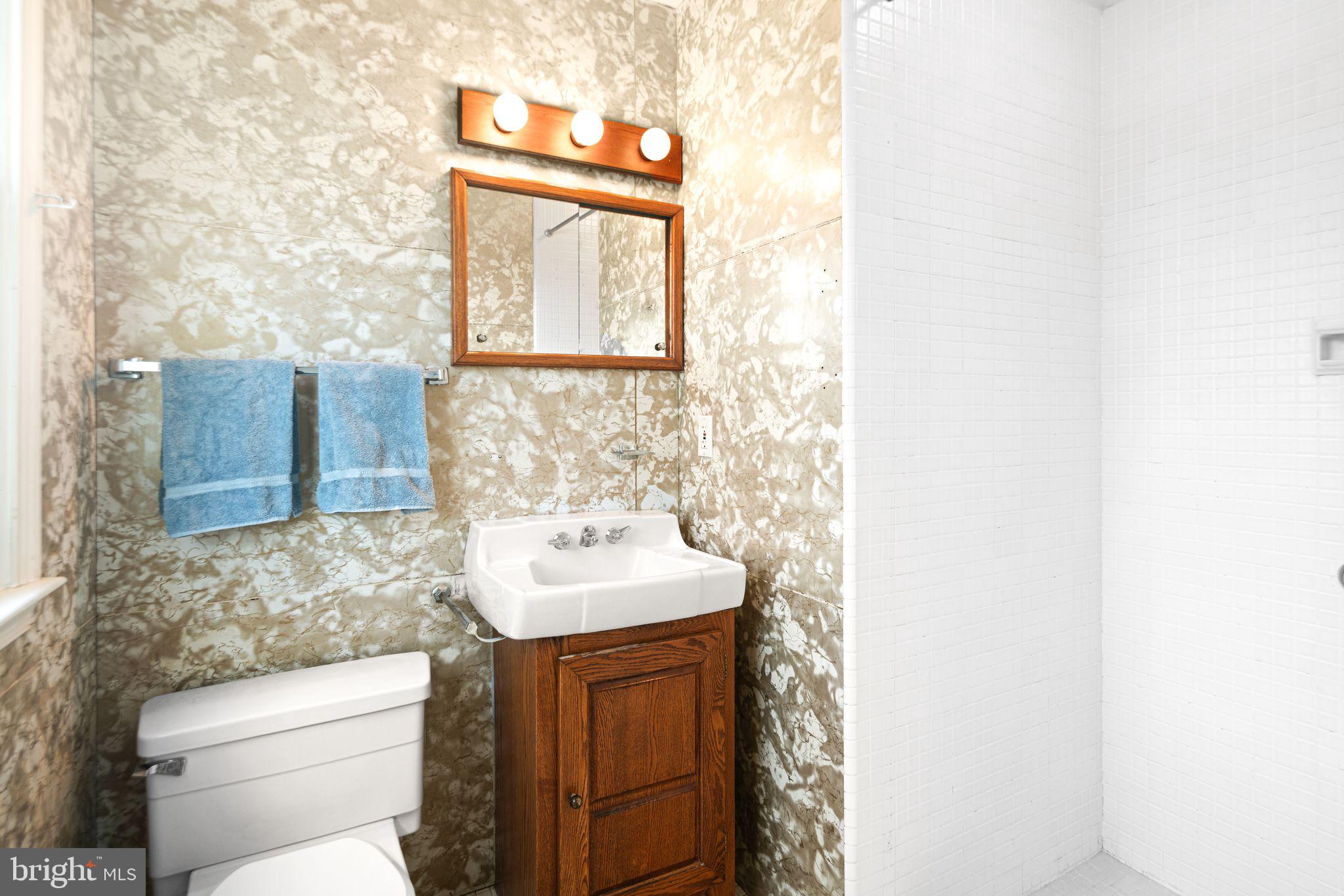 2809 Hunterdon Drive Cinnaminson, NJ 08077 - Photo 19 of 31 a bathroom with a toilet sink and mirror