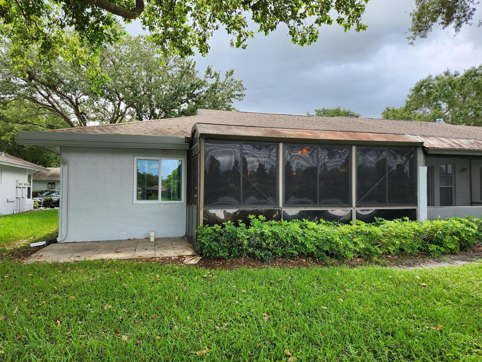 18541 Cherborg Drive, Unit D Boca Raton, FL 33496 - Photo 18 of 36 a view of a house with a garden