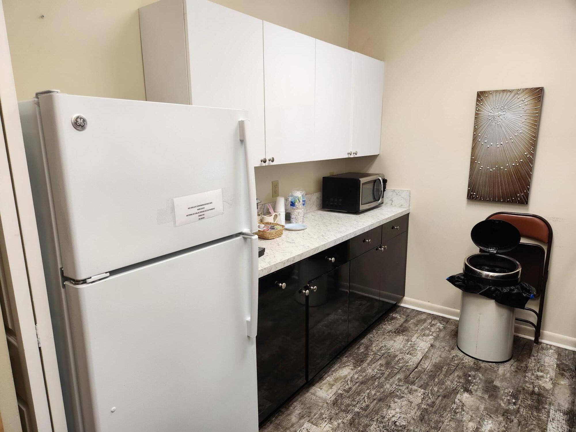 18541 Cherborg Drive, Unit D Boca Raton, FL 33496 - Photo 25 of 36 a kitchen with a refrigerator and a sink