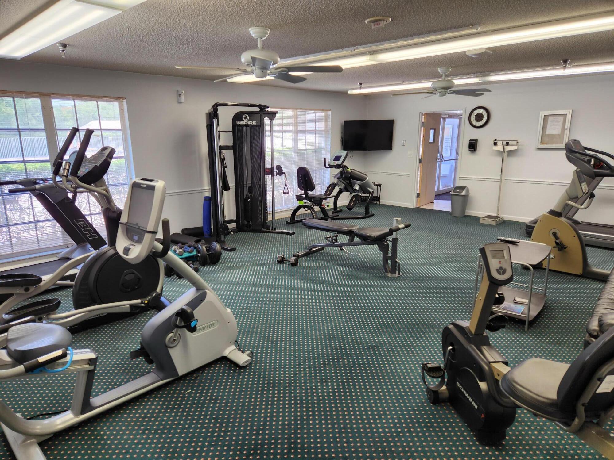 18541 Cherborg Drive, Unit D Boca Raton, FL 33496 - Photo 26 of 36 Fitness Room w/TV