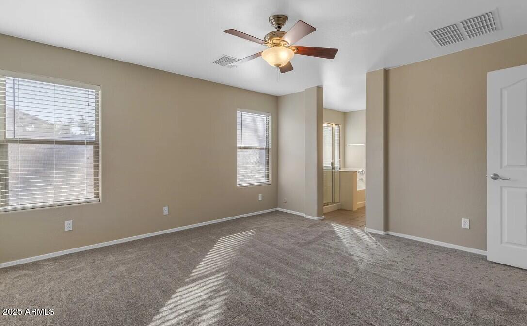 2199 West Tanner Ranch Road San Tan Valley, AZ 85144 - Photo 19 of 38 a view of an empty room with a window
