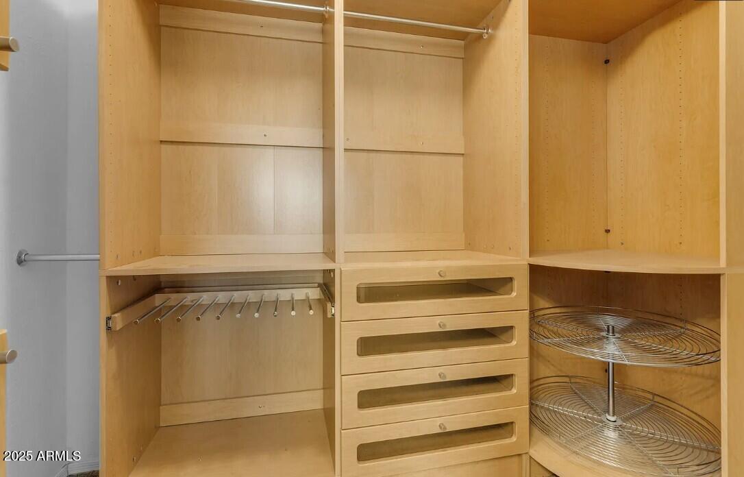 2199 West Tanner Ranch Road San Tan Valley, AZ 85144 - Photo 23 of 38 a view of walk in closet with empty racks