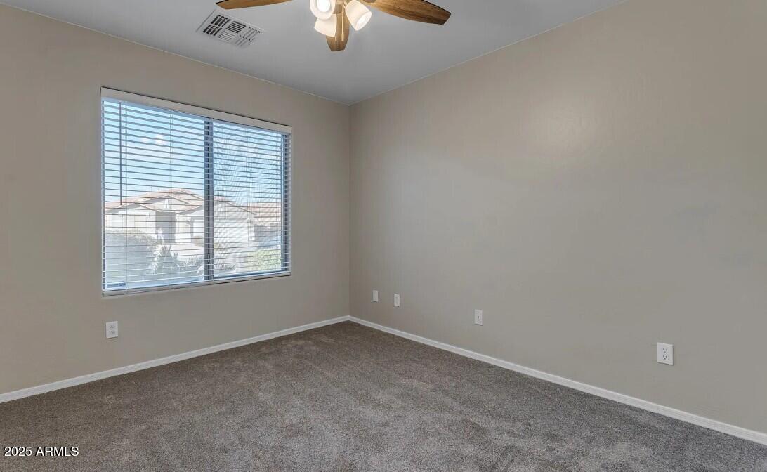2199 West Tanner Ranch Road San Tan Valley, AZ 85144 - Photo 24 of 38 an empty room with a window