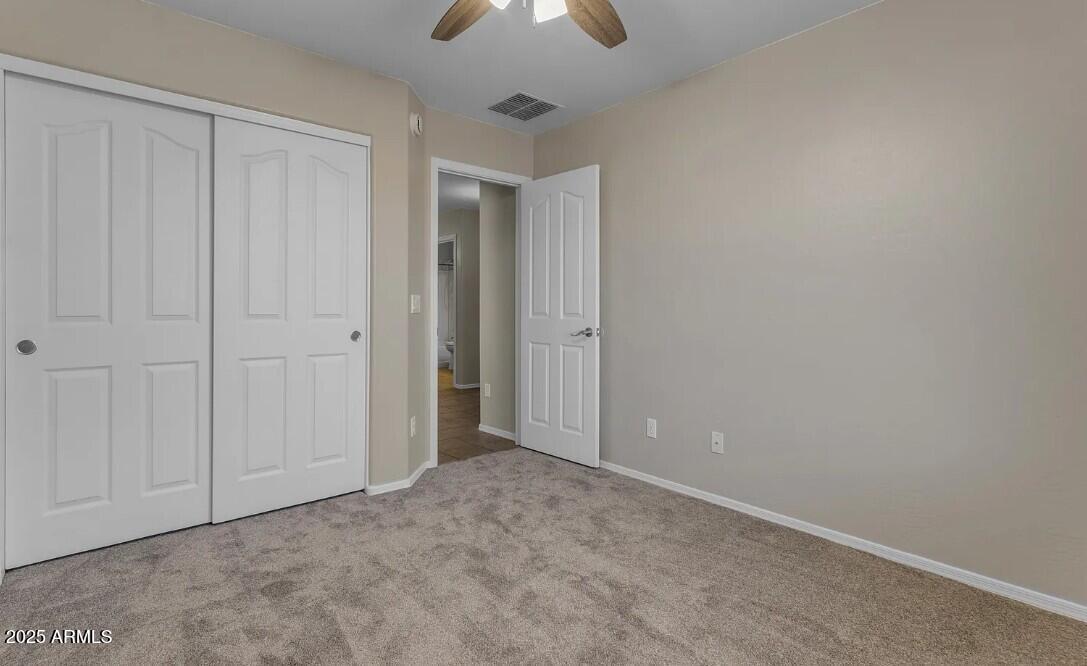 2199 West Tanner Ranch Road San Tan Valley, AZ 85144 - Photo 25 of 38 a view of an empty room and chandelier fan