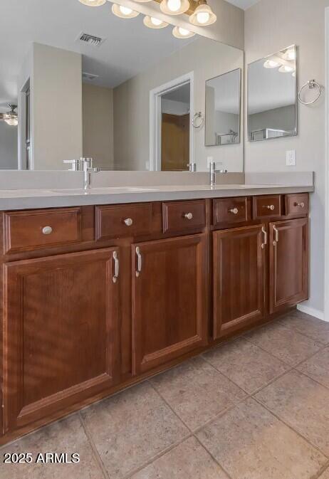 2199 West Tanner Ranch Road San Tan Valley, AZ 85144 - Photo 27 of 38 a bathroom with a sink and a mirror