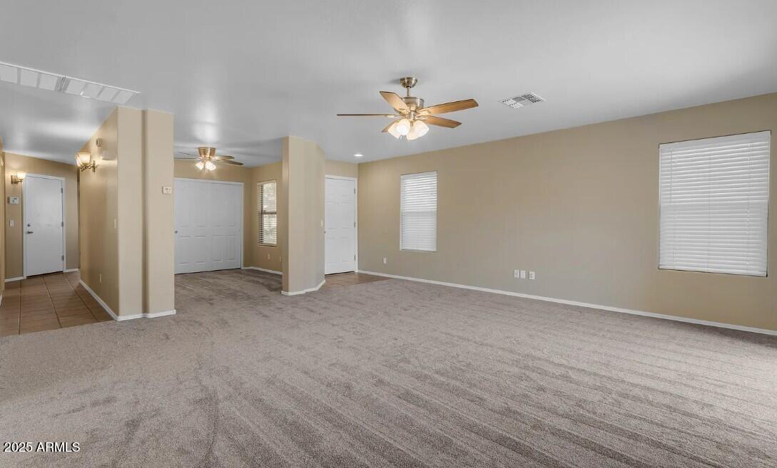 2199 West Tanner Ranch Road San Tan Valley, AZ 85144 - Photo 7 of 38 wooden floor in an empty room with a window