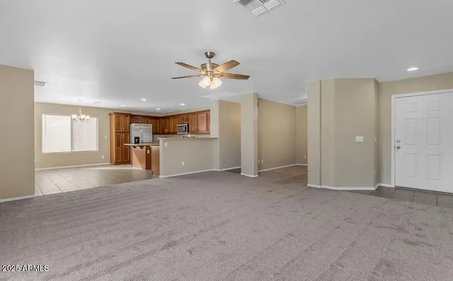 a view of a kitchen with a sink and a window