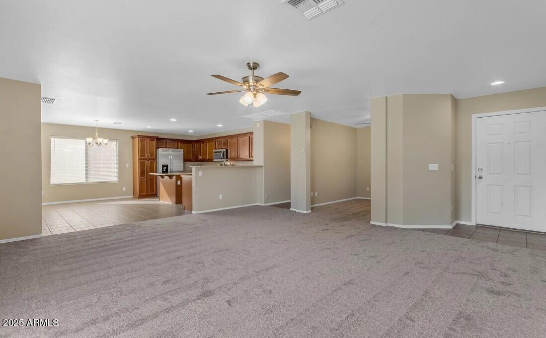 2199 West Tanner Ranch Road San Tan Valley, AZ 85144 - Photo 8 of 38 a view of a kitchen with a sink and a window
