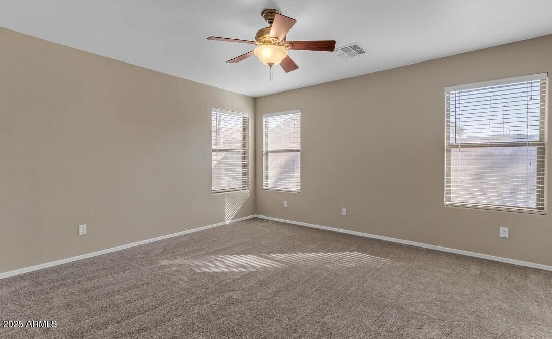 2199 West Tanner Ranch Road San Tan Valley, AZ 85144 - Photo 9 of 38 a view of a room with windows and chandelier fan