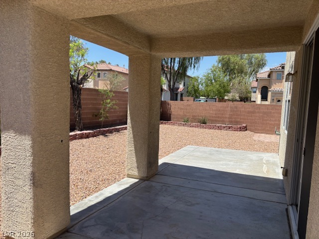 4900 Naff Ridge Drive Las Vegas, NV 89131 - Photo 21 of 21 An inviting covered patio opens to a spacious, low-maintenance yard, perfect for outdoor enjoyment.