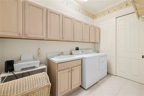 a utility room with cabinets